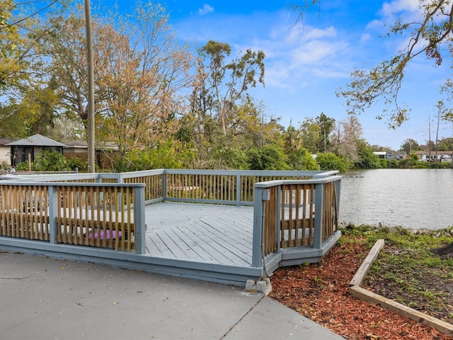 wooden terrace with a water view