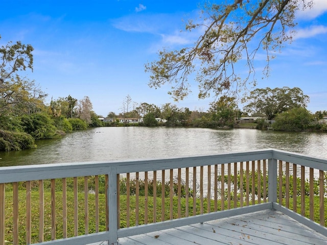 wooden deck featuring a water view