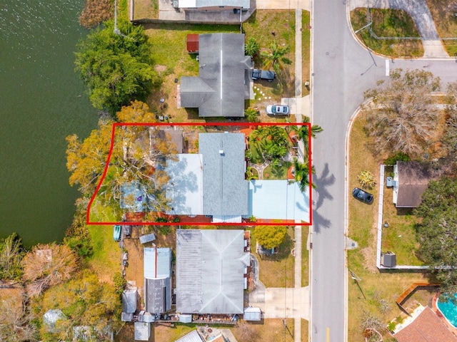 birds eye view of property with a water view