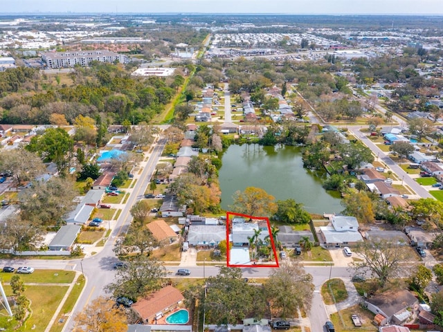 birds eye view of property with a residential view and a water view