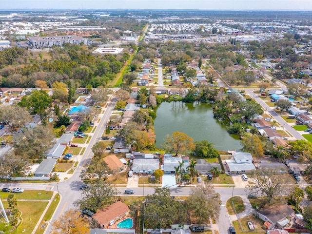 bird's eye view featuring a water view and a residential view