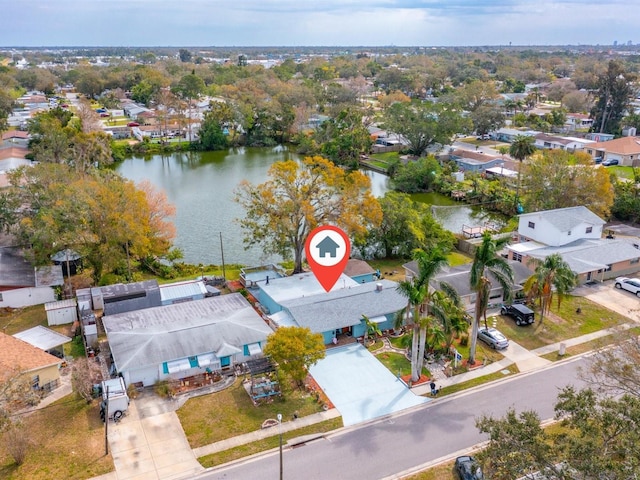 drone / aerial view with a water view and a residential view