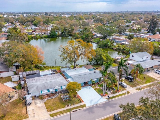 birds eye view of property with a residential view and a water view