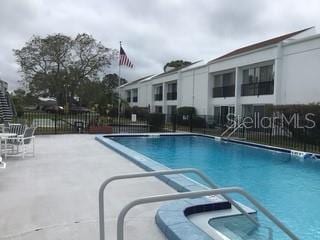 view of swimming pool with a patio