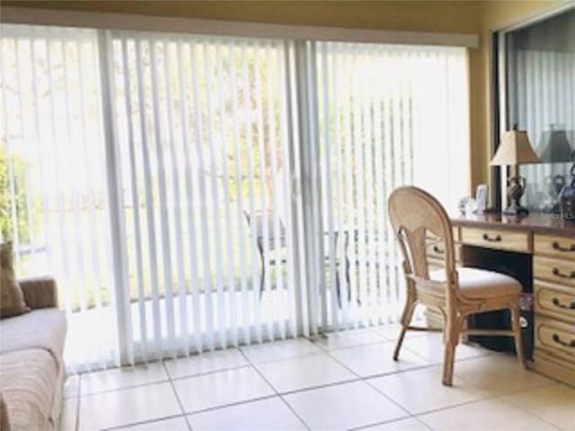 home office featuring tile patterned flooring and plenty of natural light