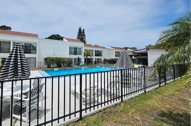 community pool featuring fence