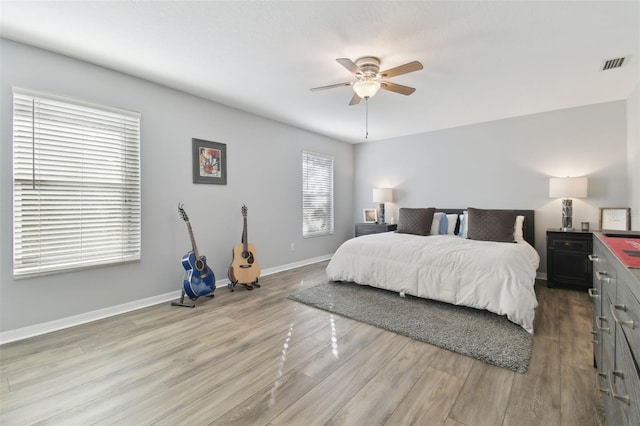 bedroom featuring ceiling fan and light hardwood / wood-style floors