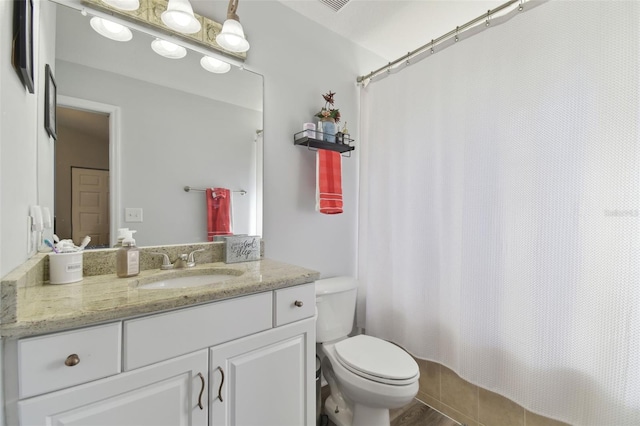 bathroom with vanity and toilet