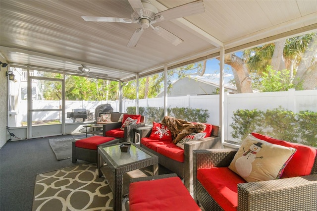 sunroom with a wealth of natural light and ceiling fan