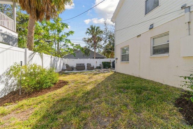 view of yard with outdoor lounge area and a patio area