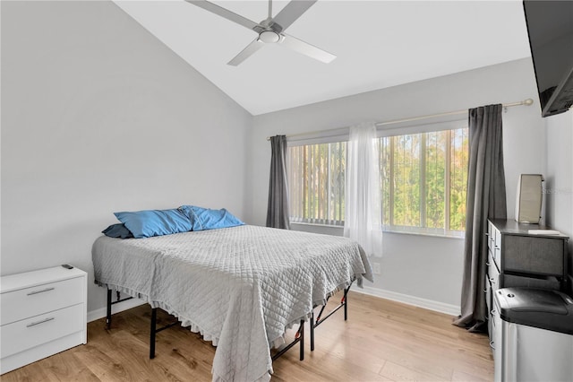 bedroom featuring vaulted ceiling, ceiling fan, and light hardwood / wood-style floors