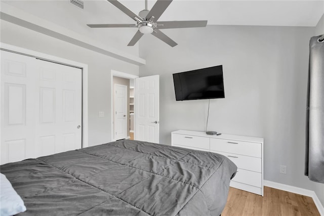 bedroom featuring a closet, ceiling fan, and light wood-type flooring