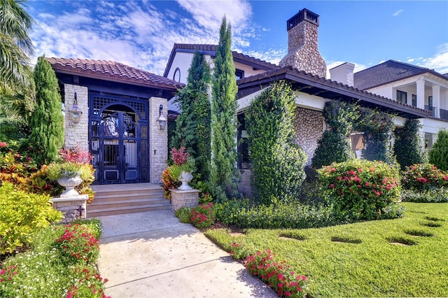 exterior space with a yard and french doors