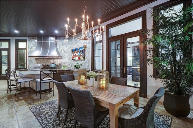 dining room featuring french doors and wood ceiling