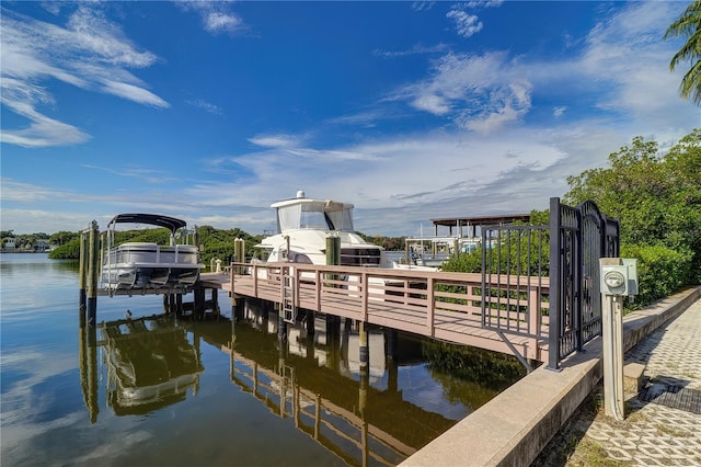 dock area featuring a water view and boat lift