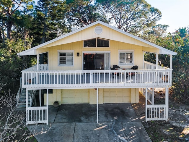 view of front of house with a garage and a wooden deck