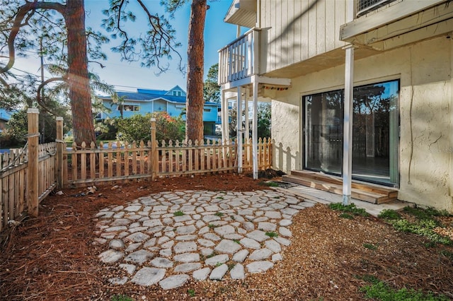 view of yard with a balcony