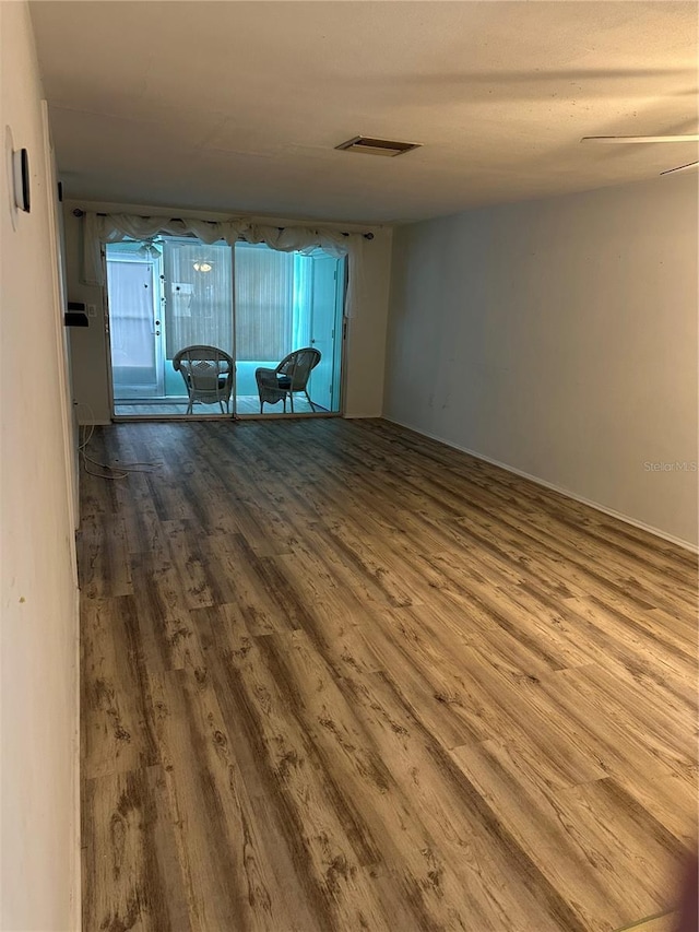 unfurnished room featuring wood-type flooring