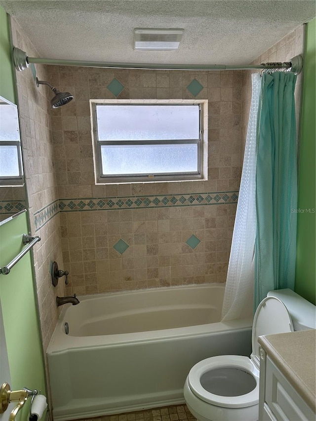 full bathroom with shower / bath combination with curtain, a healthy amount of sunlight, and vanity