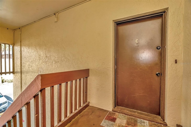 entrance to property featuring a balcony