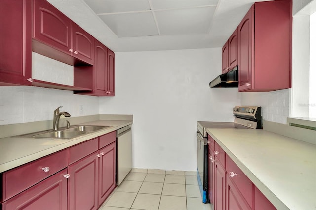 kitchen with sink, light tile patterned floors, and appliances with stainless steel finishes