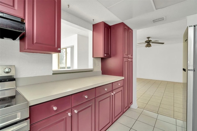 kitchen with light tile patterned flooring, ventilation hood, range with electric stovetop, stainless steel fridge, and ceiling fan