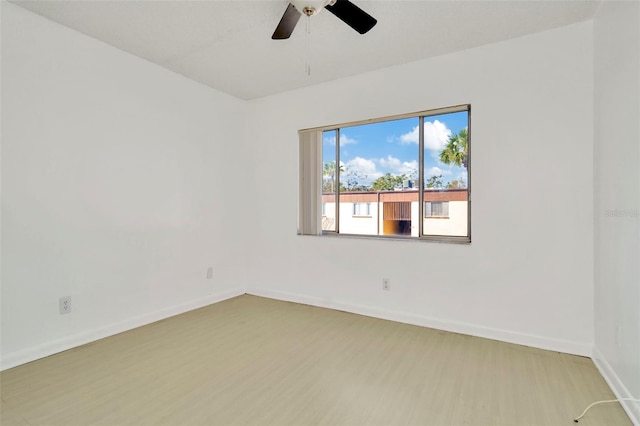 unfurnished room featuring light hardwood / wood-style floors and ceiling fan