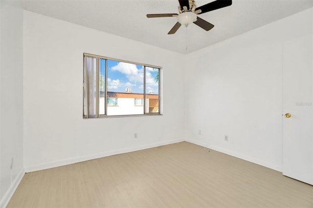 unfurnished room featuring ceiling fan and light wood-type flooring