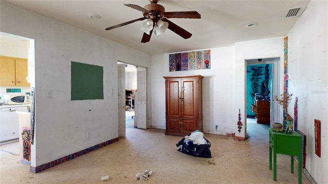 interior space with ceiling fan