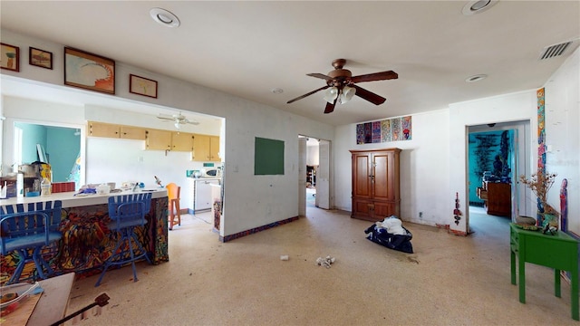 interior space with ceiling fan