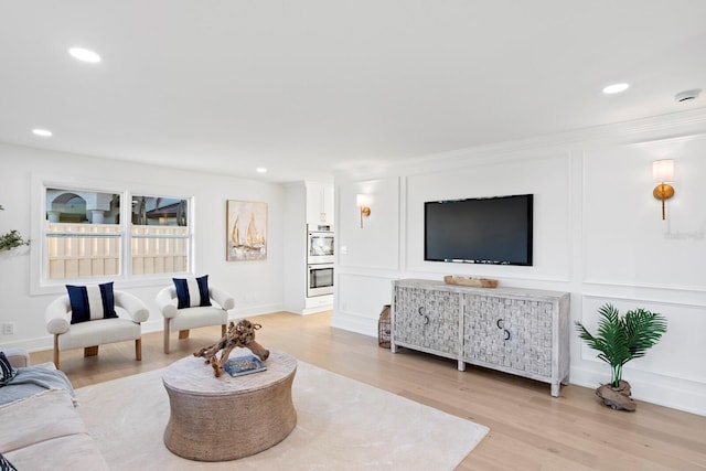 living room with light hardwood / wood-style flooring