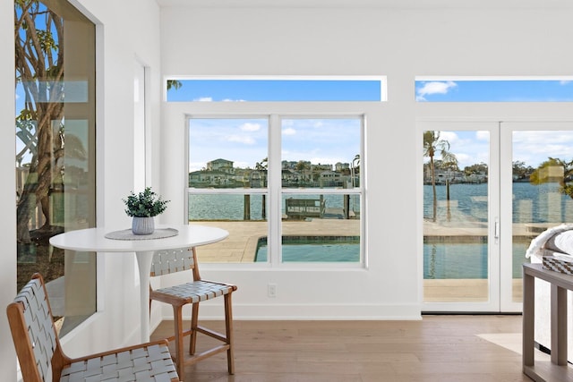 interior space featuring a water view and light hardwood / wood-style flooring