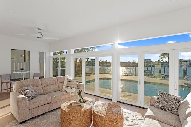 sunroom / solarium with a water view