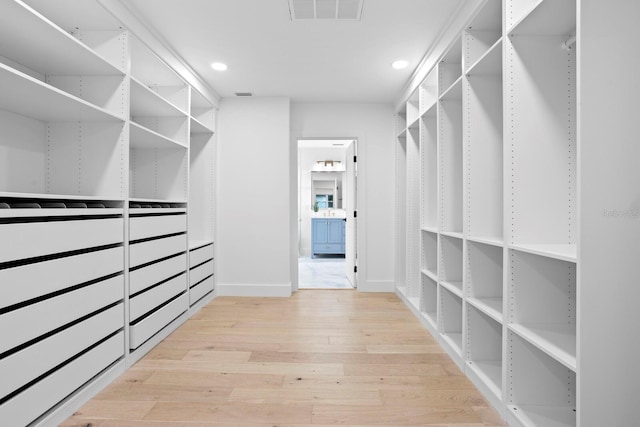 walk in closet featuring hardwood / wood-style flooring