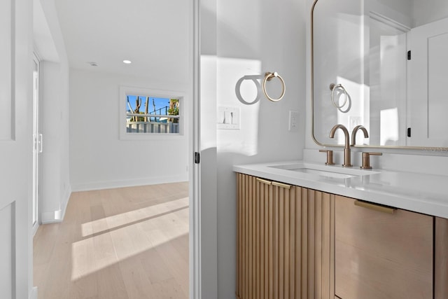 bathroom featuring vanity and hardwood / wood-style floors