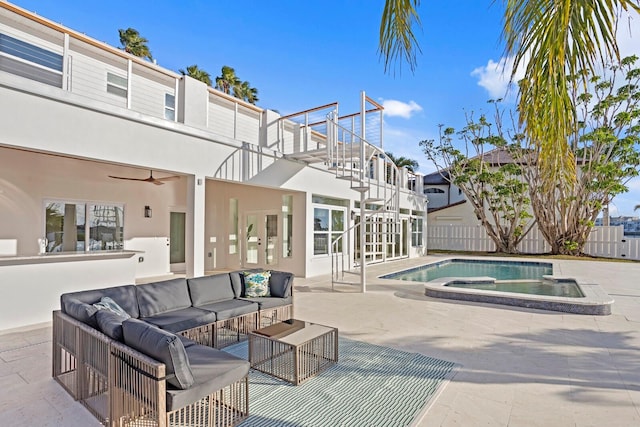 view of swimming pool featuring an in ground hot tub, an outdoor living space, and a patio