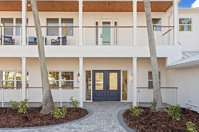 exterior space with french doors and a balcony