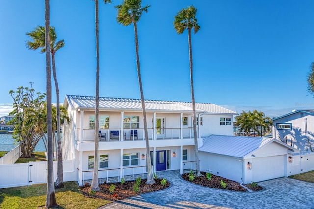 view of front of house with a garage and a balcony