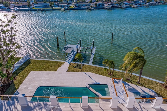 view of basketball court with a fenced in pool and a water view