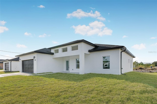 prairie-style house with a garage and a front yard