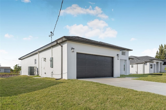 exterior space with a garage, central AC unit, and a lawn