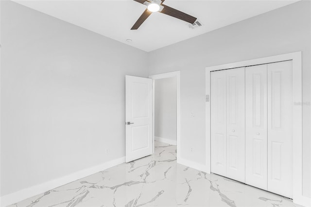 unfurnished bedroom featuring a closet and ceiling fan