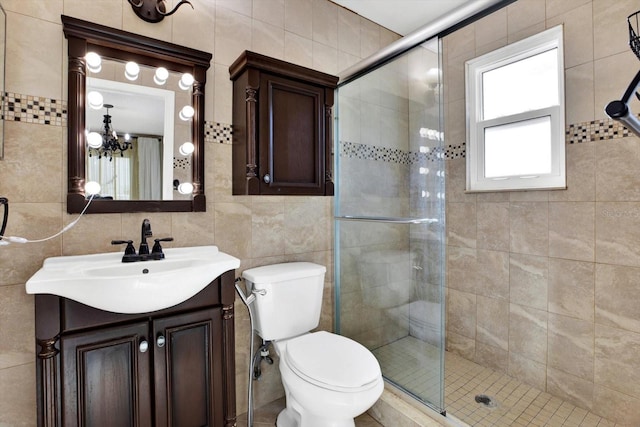 bathroom featuring tile walls, backsplash, vanity, walk in shower, and toilet