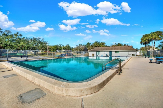 view of swimming pool featuring a patio area