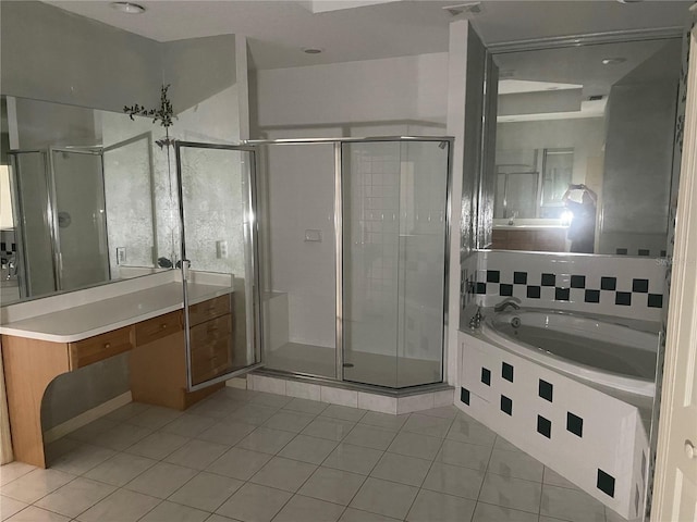 bathroom featuring tile patterned flooring, vanity, and separate shower and tub