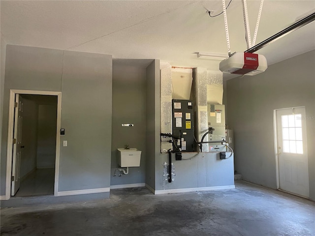 garage with a garage door opener and sink