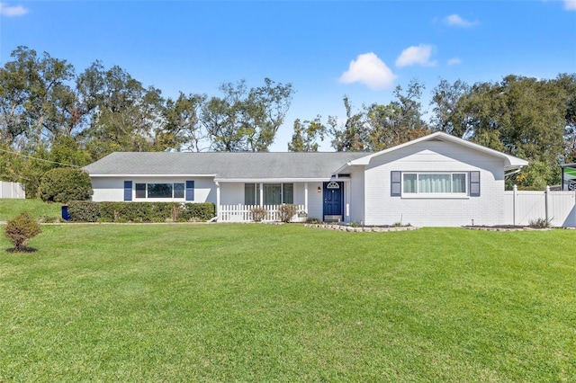 ranch-style house with a front lawn