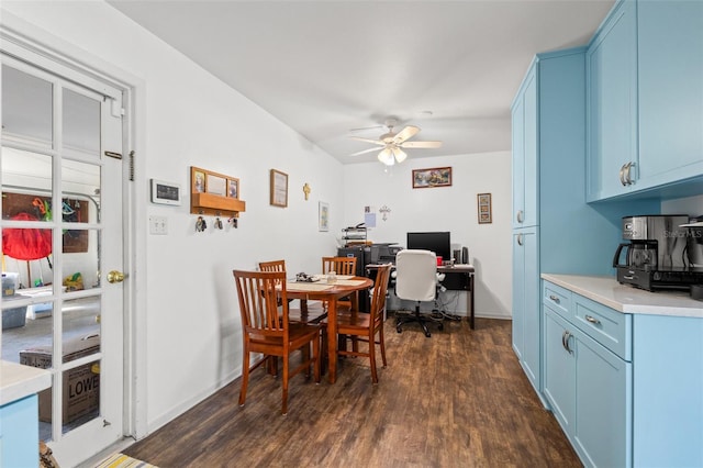 dining space featuring dark wood-type flooring and ceiling fan