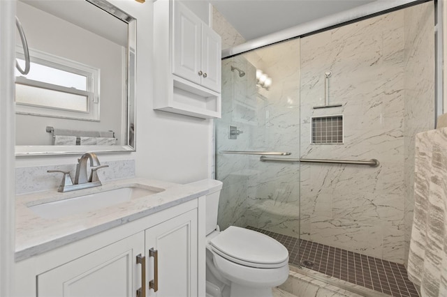 bathroom with vanity, toilet, and walk in shower