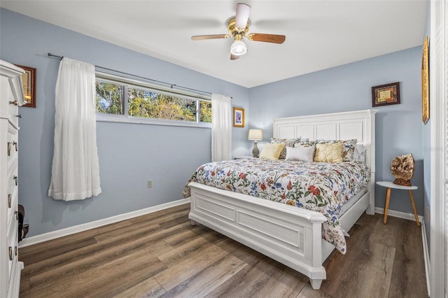 bedroom with dark wood-type flooring and ceiling fan